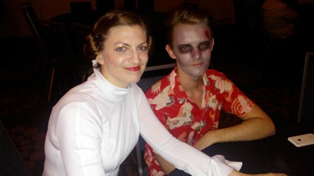 Adviser Melissa Alling and Jack Kelly, editor-in-chief at In the Write Mind, enjoy the karaoke costume party. 